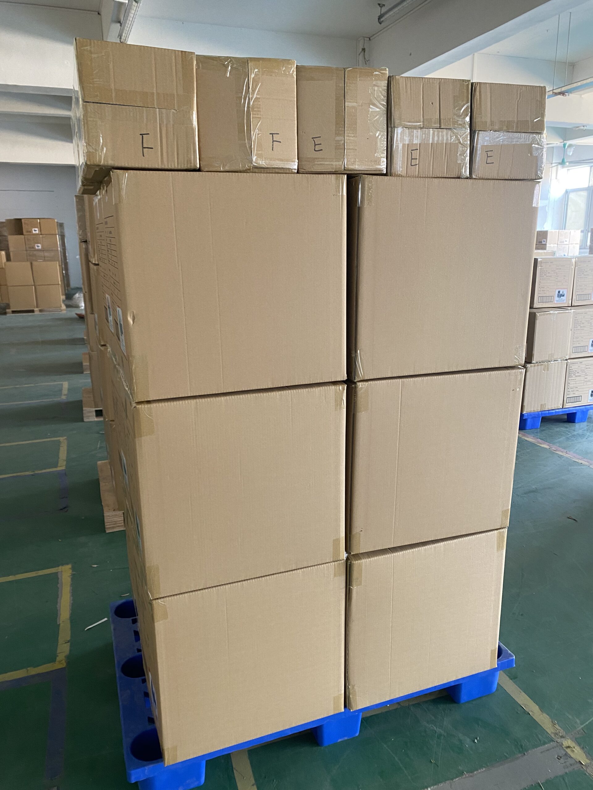 Many cartons of body groomers trimmer on the Wooden pallet in warehouse